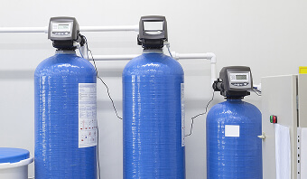 Water softener equipment displayed, highlighting its role in enhancing household water softness and clarity.