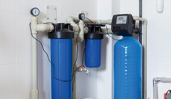 Water softener systems displayed, showcasing various models and features for improving water quality.